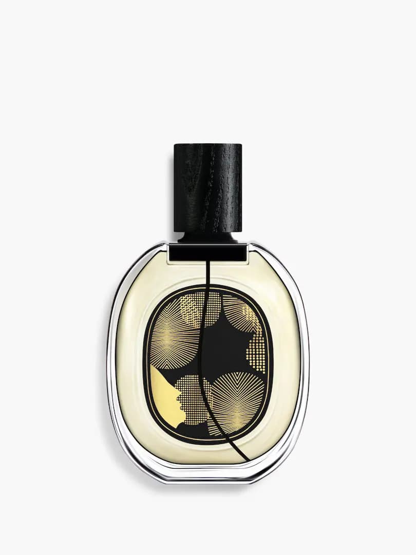 Back of Orphéon bottle with gold radiating lines, dot patterns and a profile silhouette