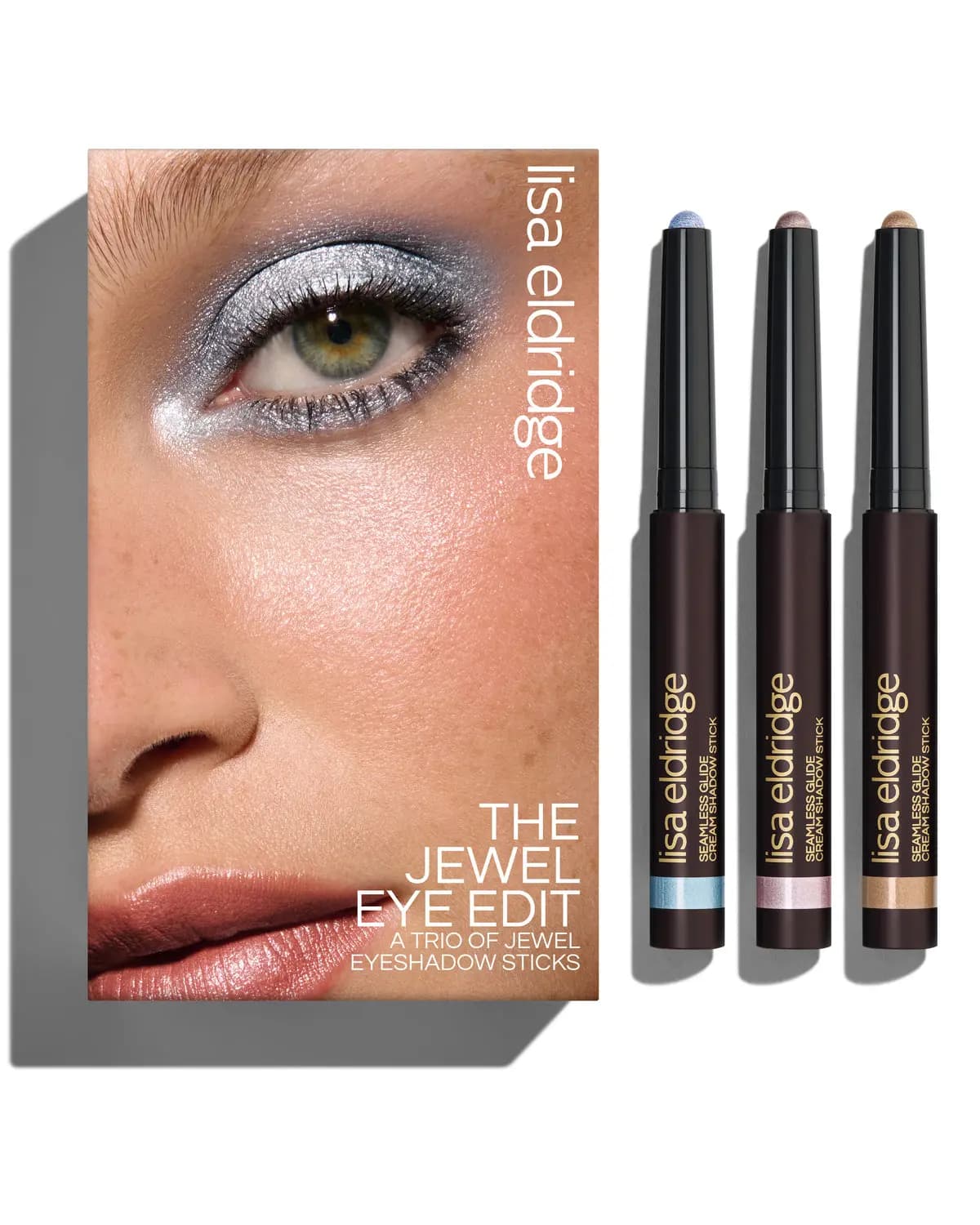 The Jewel Eye Edit box with a silver-blue eye look beside three shadow sticks with blue, pink and gold bands