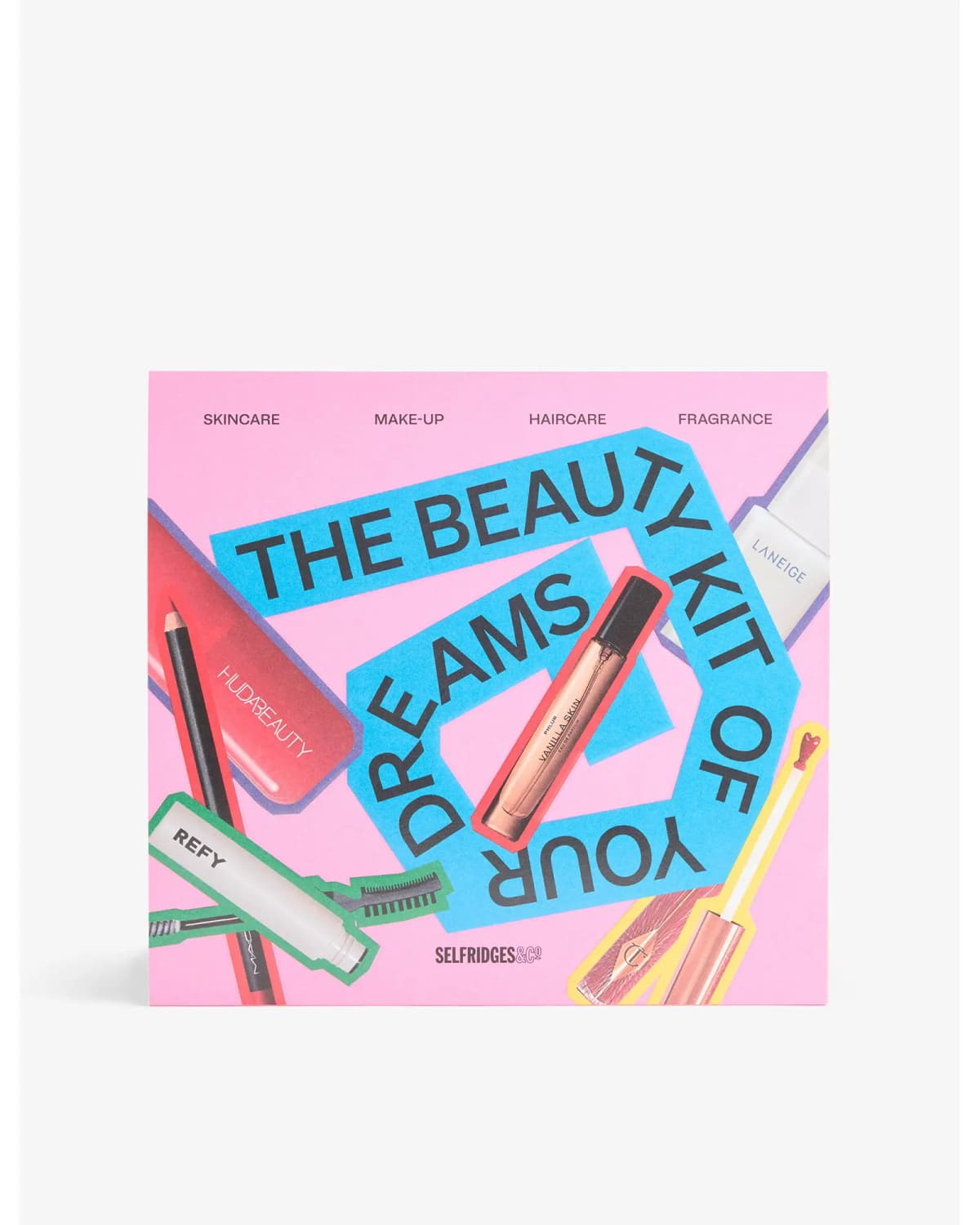 Pink Selfridges box printed The Beauty Kit of Your Dreams with blue lettering and collage of Huda Beauty, Refy