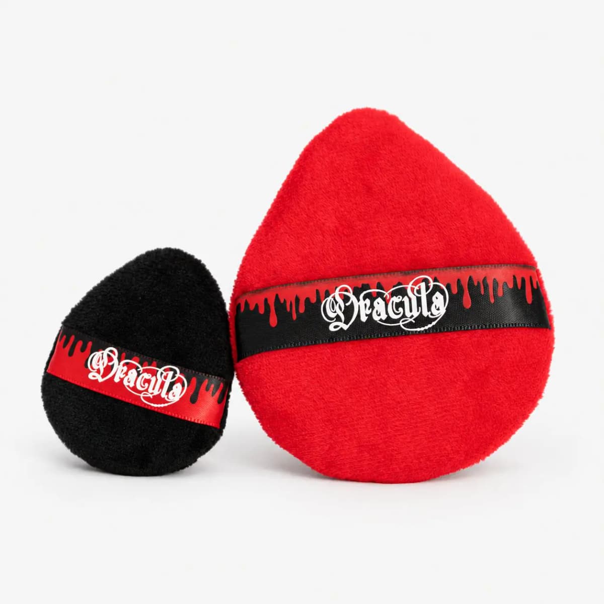 Black and red teardrop powder puffs wrapped in dripping-blood Dracula ribbon bands