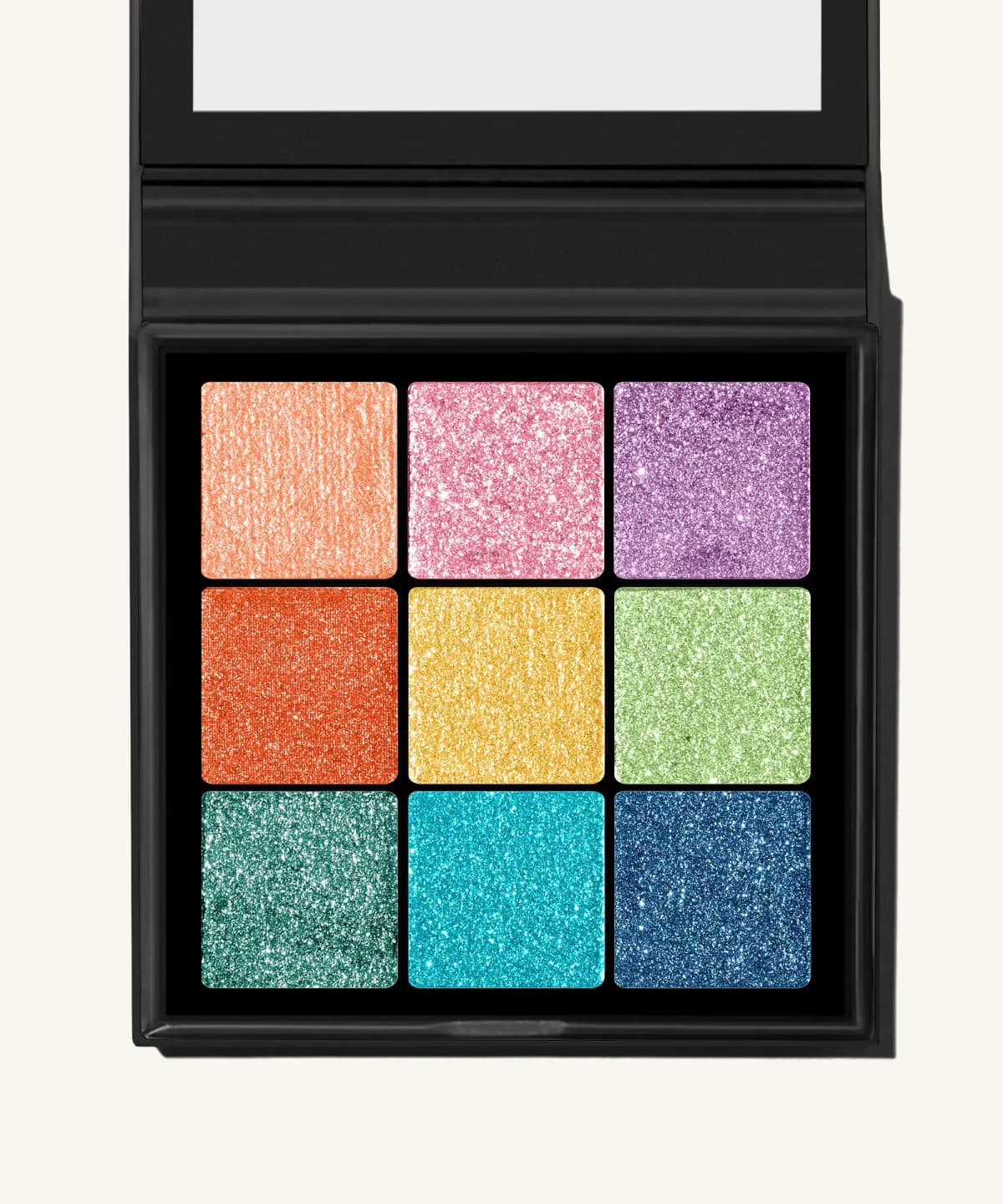 By BEAUTY BAY Mini Charms Bright 9 Colour Palette eyeshadow, open black compact with nine glittery rainbow shimmer pans