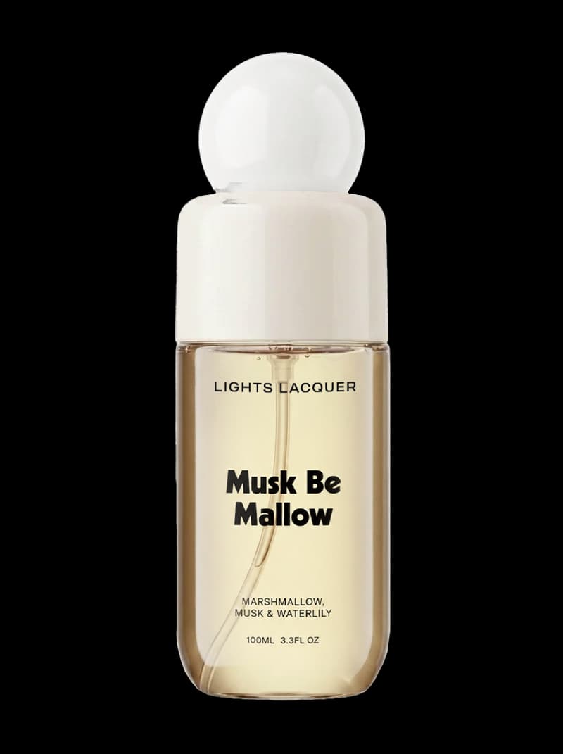 Lights Lacquer Musk Be Mallow Hair & Body Mist in a clear bottle of pale golden liquid with a round white cap