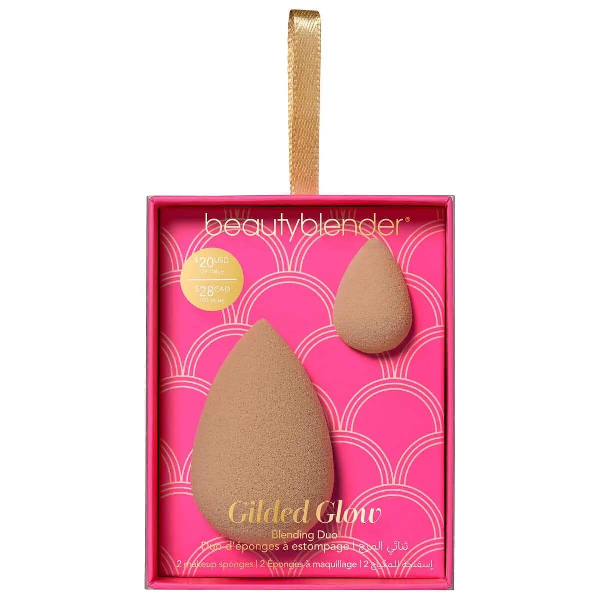 Gilded Glow Blending Duo box with full-size and micro mini nude sponges on a hot pink scalloped backdrop