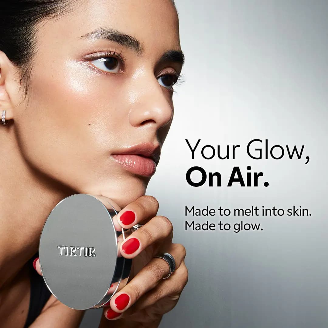 Model with glowing skin and red nails holds a silver TIRTIR compact beside the text "Your Glow, On Air.