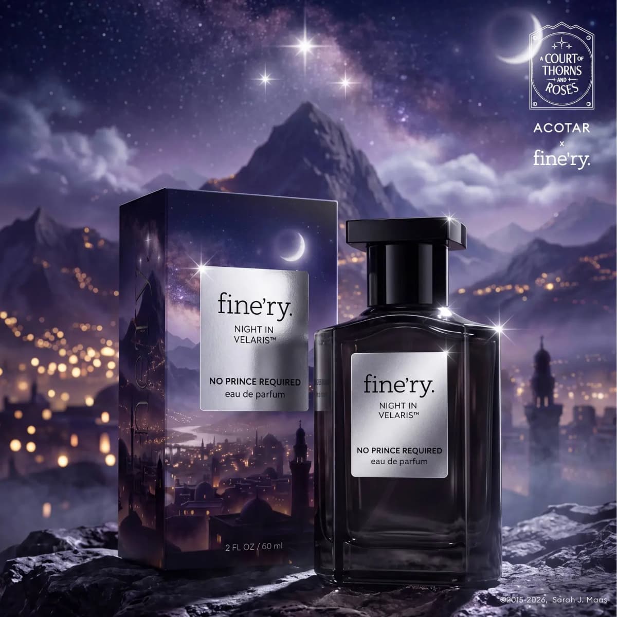 Night in Velaris bottle and box on rocks before a purple mountain city glowing with lights under stars and a crescent moon