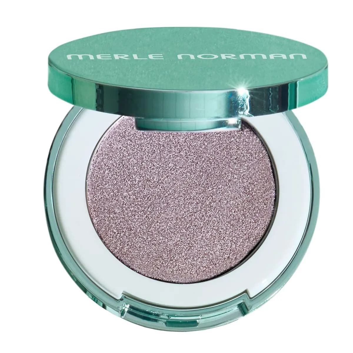 Open mint Merle Norman compact with a sparkly lilac-mauve eye shadow pan on white
