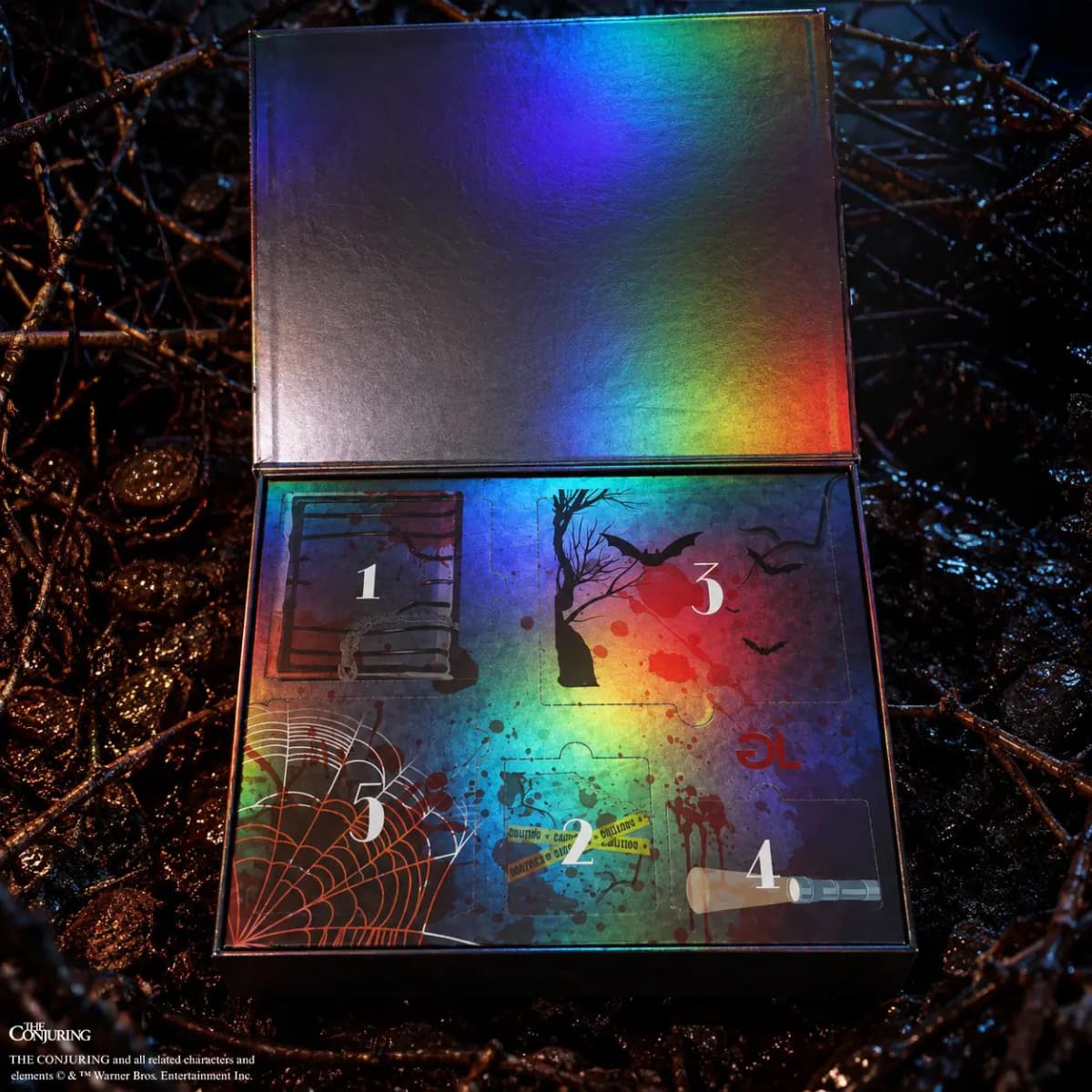 Open holographic Glamlite Conjuring horror box with five numbered spooky compartments, set among dark twisted branches