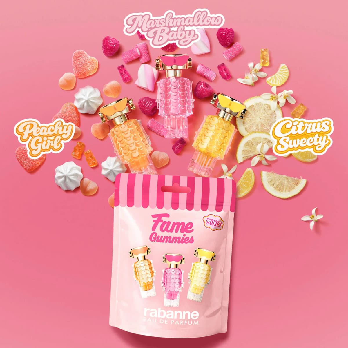 Peach, pink and yellow mini bottles bursting from a candy pouch with Peachy Girl, Marshmallow Baby and Citrus Sweety labels