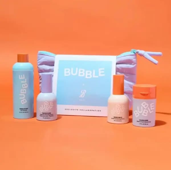 Bubble skincare bottles and a lilac puffy zip bag with a Bubble x B Bag sleeve on a bright orange backdrop