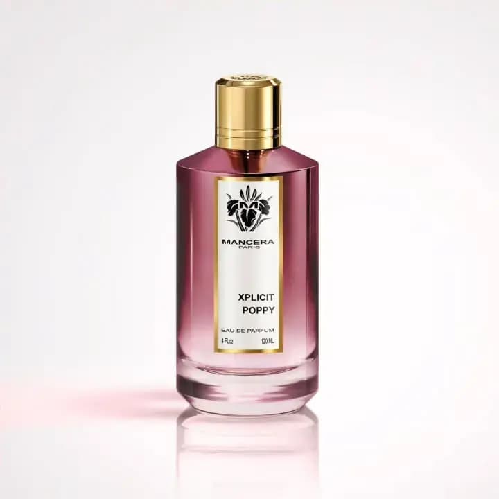 Xplicit Poppy bottle in pink-to-clear gradient glass with a gold cap and floral crest label on a white background
