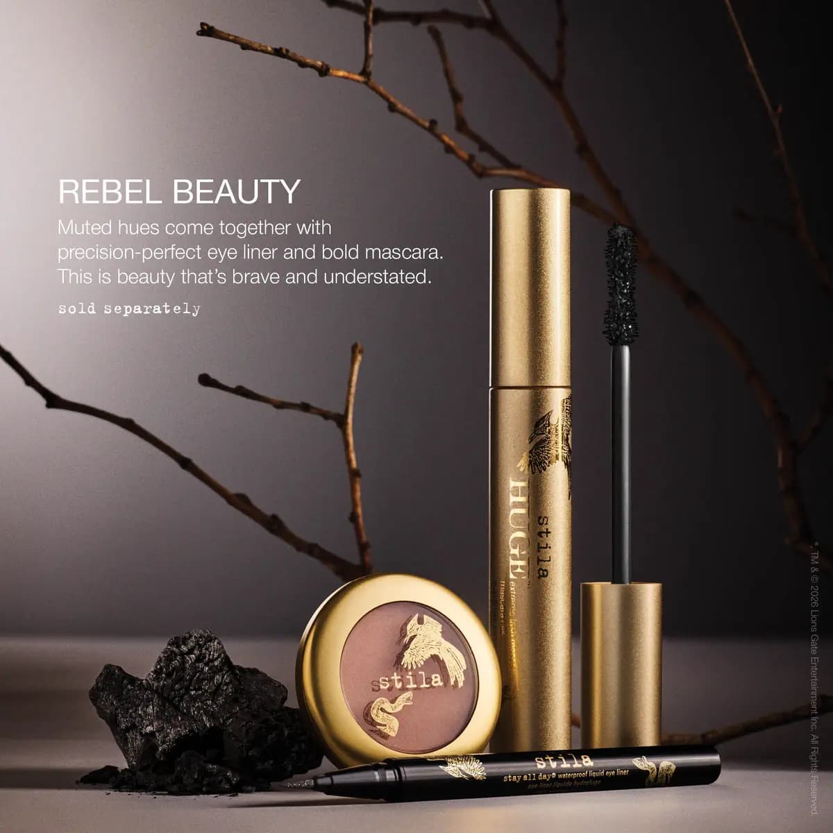 Rebel Beauty look: HUGE mascara, taupe eye shadow compact and black stay all day liquid liner beside charcoal and twigs
