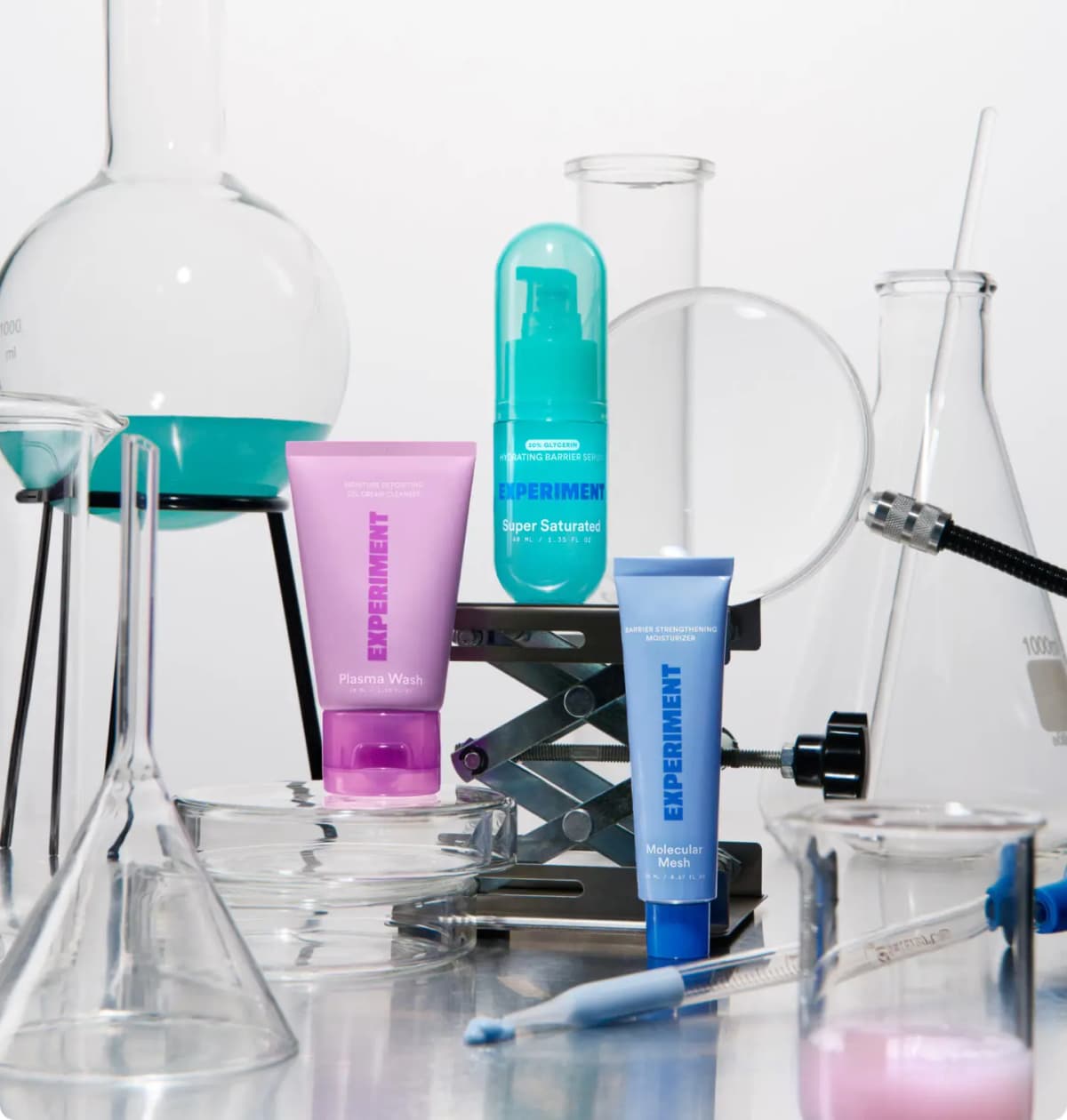 Experiment Plasma Wash, Super Saturated and Molecular Mesh standing among laboratory flasks and a lab jack on a white bench