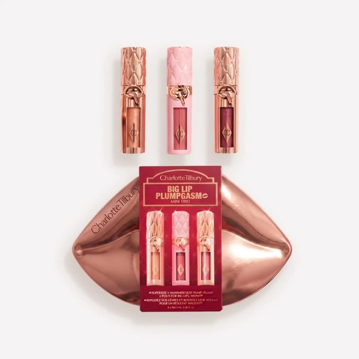 Big Lip Plumpgasm Mini Trio: three quilted-cap glosses above a rose-gold lip-shaped case and red sleeve