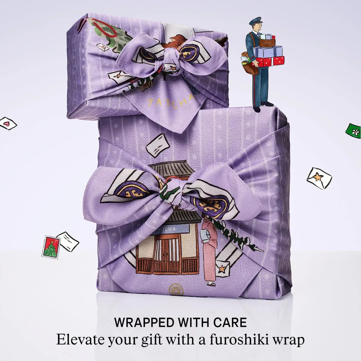 Lilac Tatcha furoshiki-wrapped gifts with bows, a tiny illustrated postman on top; text reads Wrapped With Care