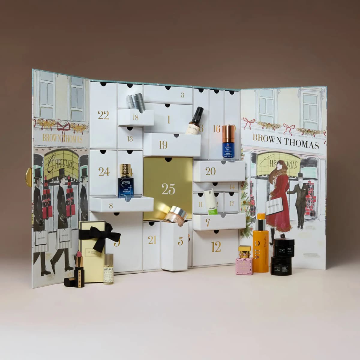 Angled view of the open Brown Thomas calendar with drawers ajar revealing perfumes, creams and beauty minis