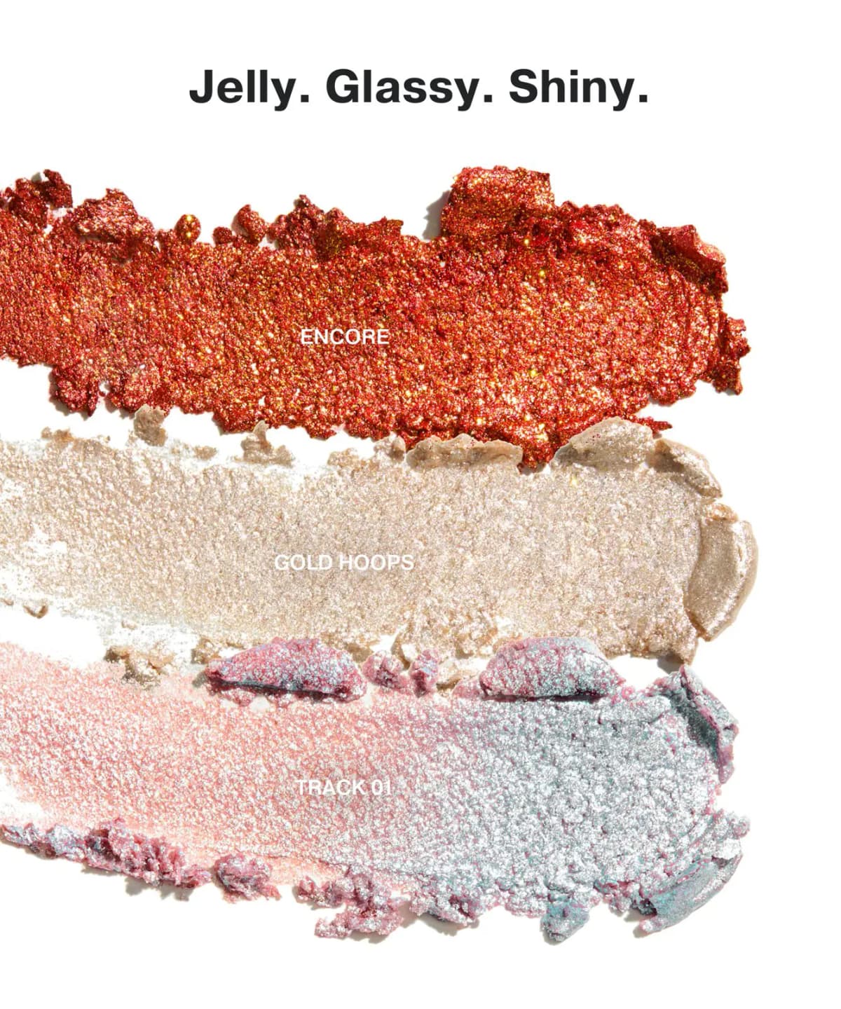Bouncy Beam shimmer stick swatches labelled Encore (bronze), Gold Hoops (champagne) and Track 01 (silver-pink duochrome), titled "Jelly. Glassy. Shiny."
