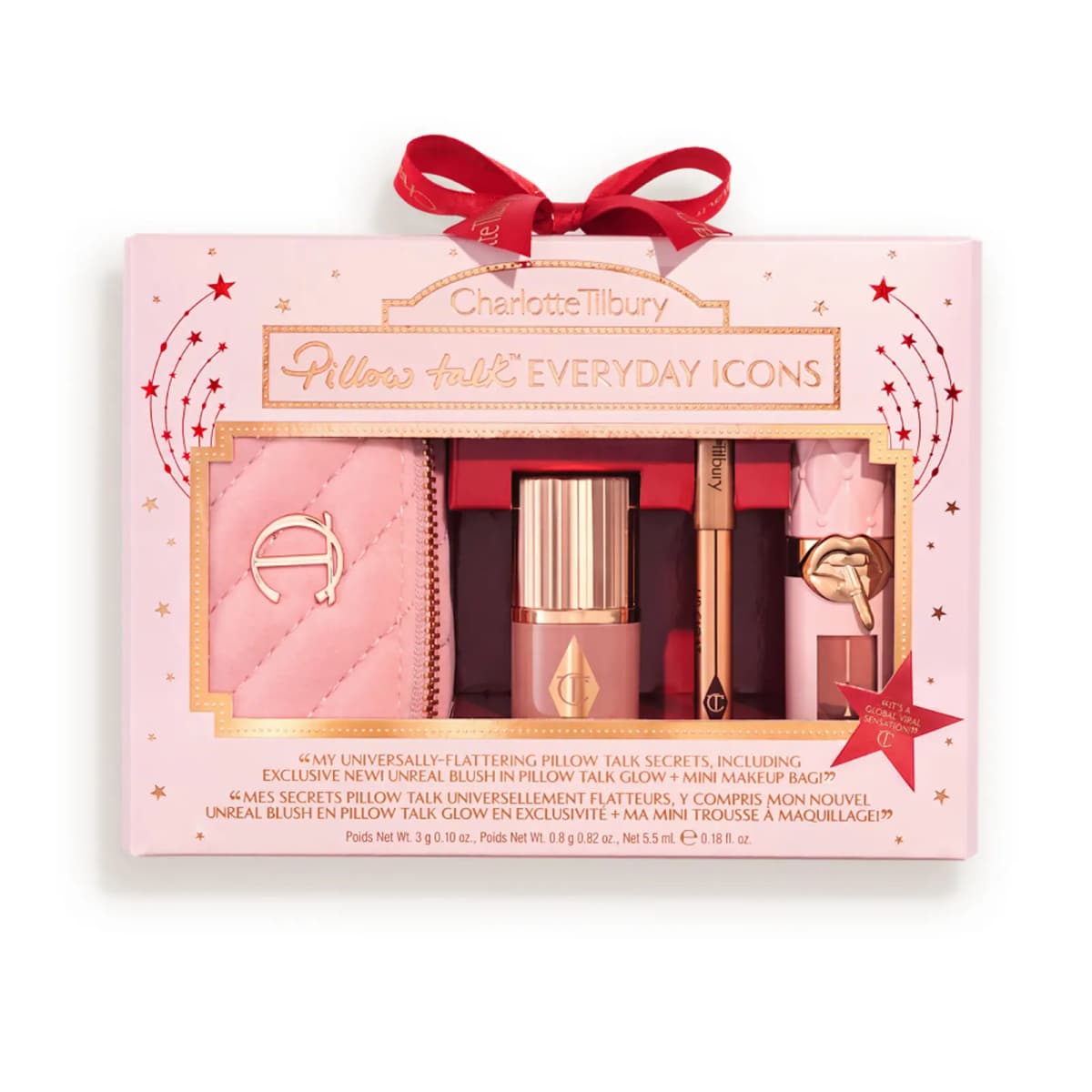Pink gift box with red ribbon bow and gold foil frame, window showing velvet bag, blush stick, liner and gloss