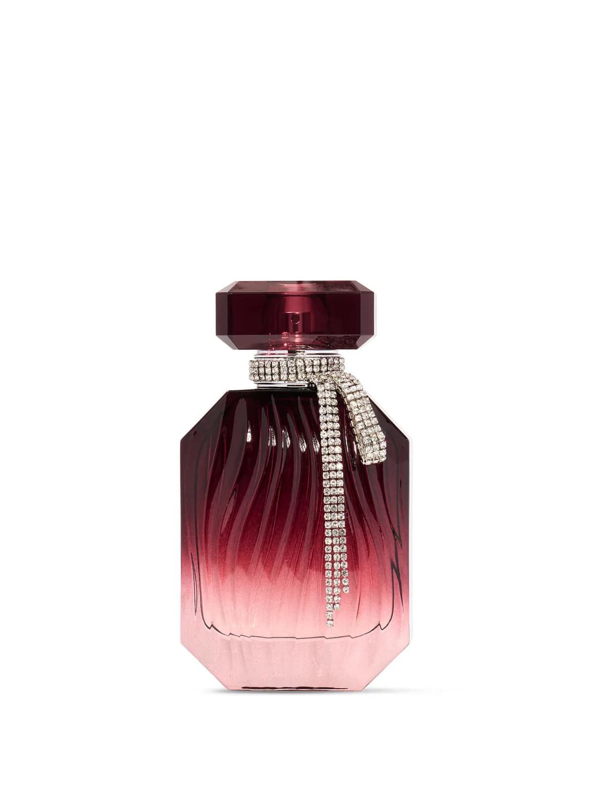 Victoria's Secret Bombshell Desire Eau de Parfum bottle in burgundy-to-pink ombré glass with a rhinestone bow at the neck