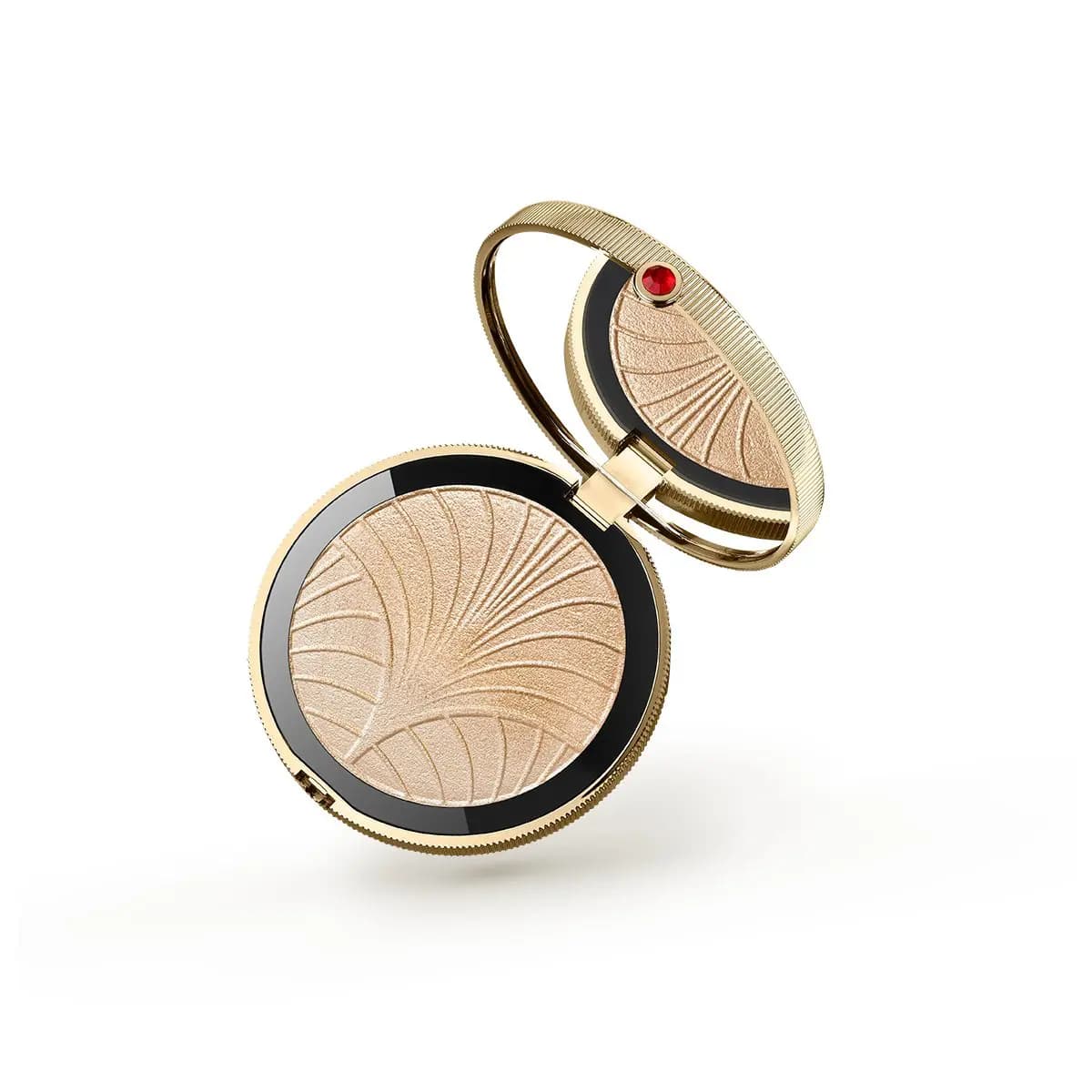 Gold compact with red gem and a champagne highlighter embossed with art deco fan lines