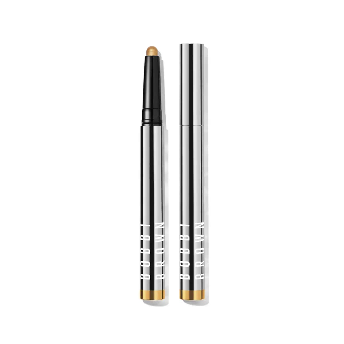 Gold-tipped Bobbi Brown shadow stick in striped silver chrome packaging, shown open beside its capped tube.