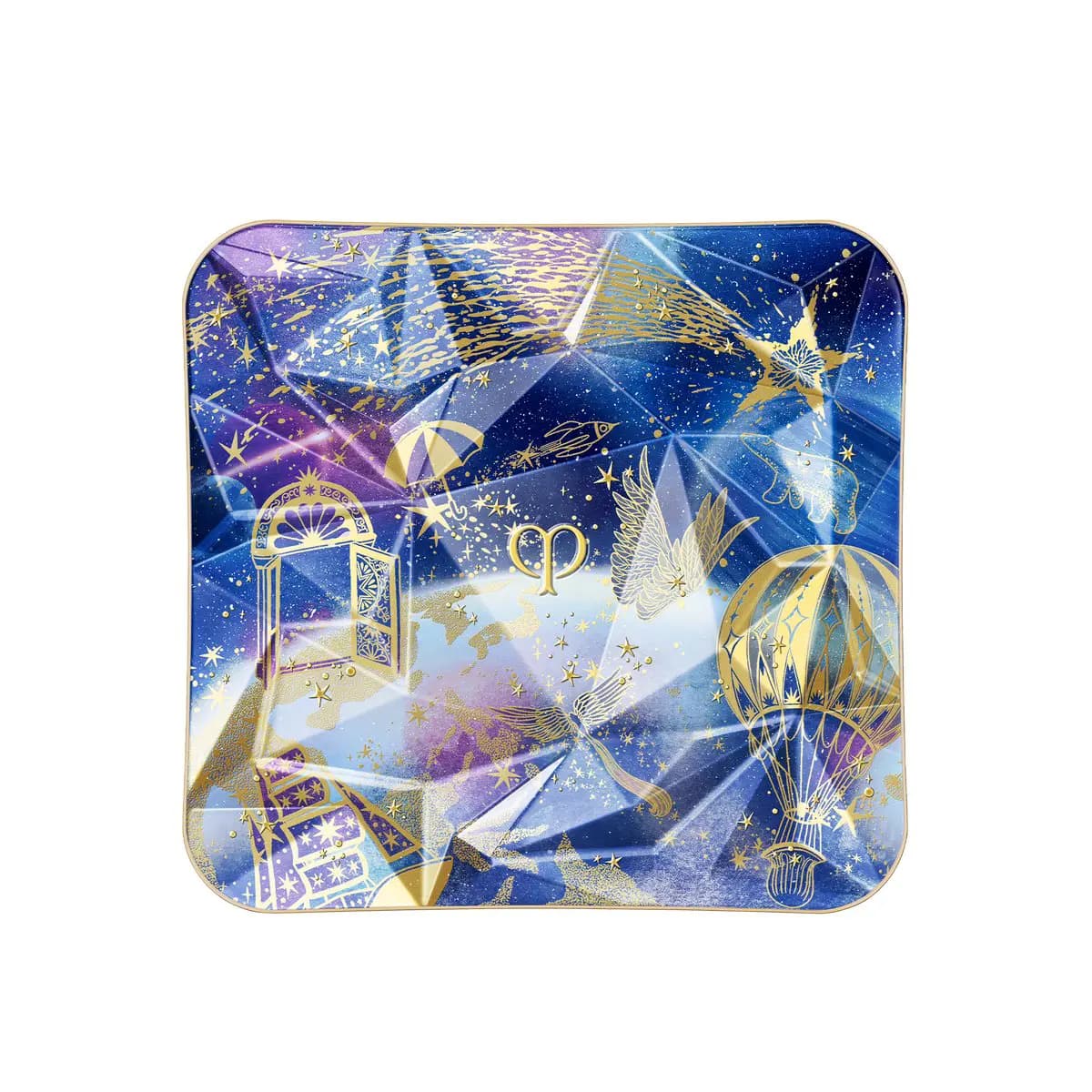 Square compact lid in blue and purple faceted print with gold stars, wings, umbrella, door and hot air balloon