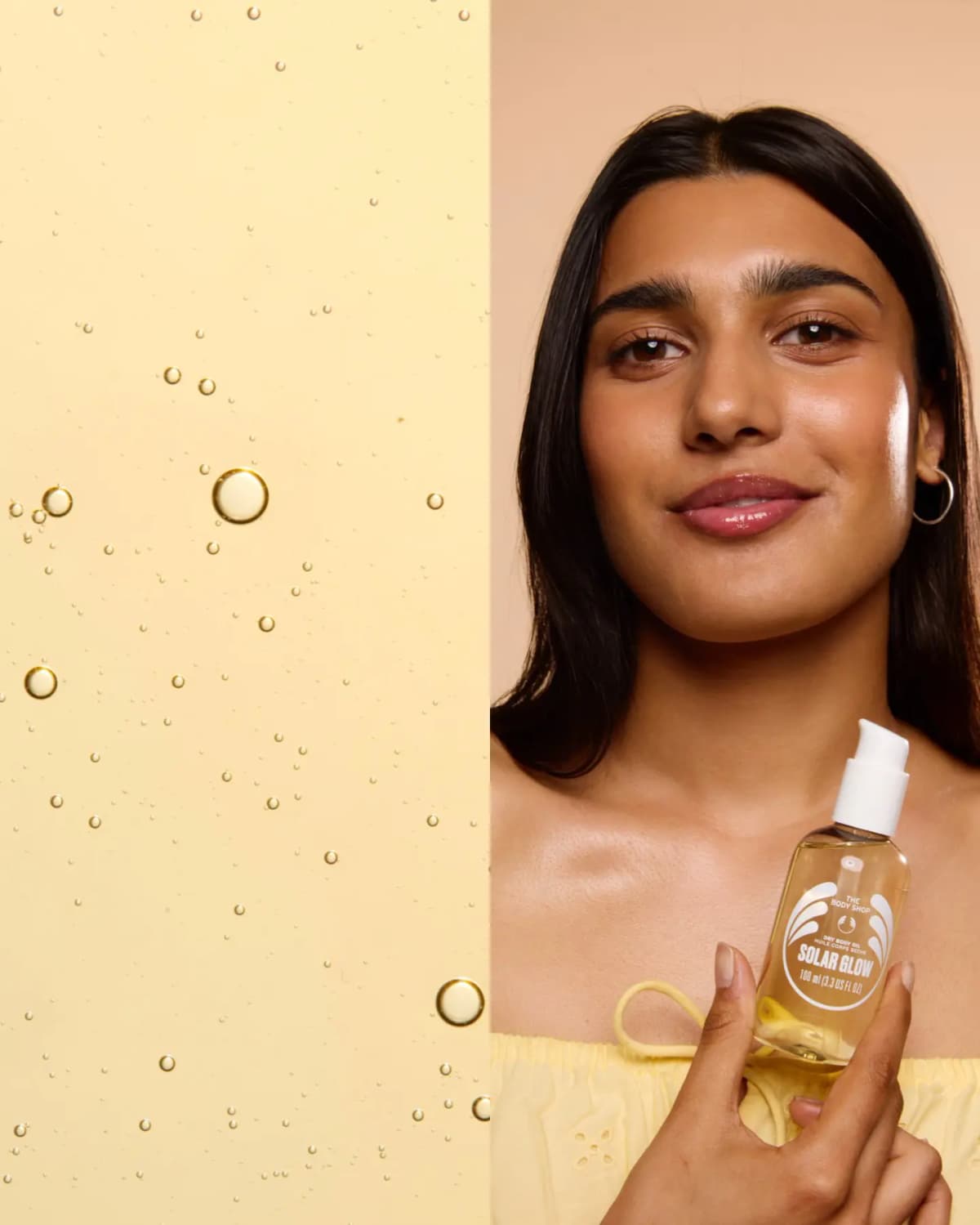Pale yellow oil texture with bubbles beside a smiling model holding a clear Solar Glow dry body oil bottle