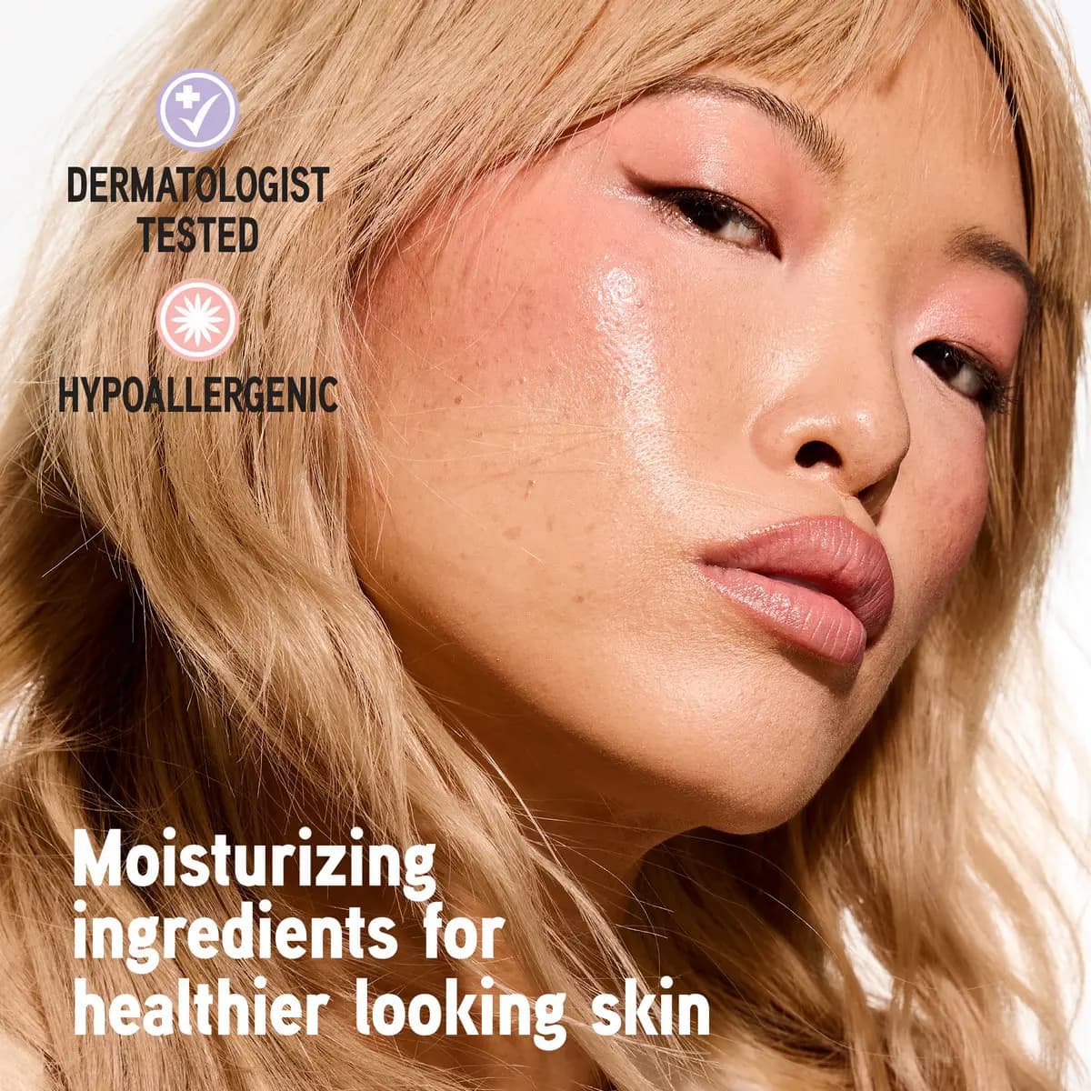 Blonde Asian model with dewy peach blush on cheeks, dermatologist tested and hypoallergenic icons on left