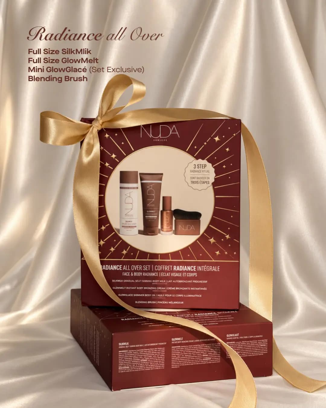 NUDA Radiance All Over Set box with gold ribbon, showing SilkMilk, GlowMelt, mini GlowGlacé and blending brush.