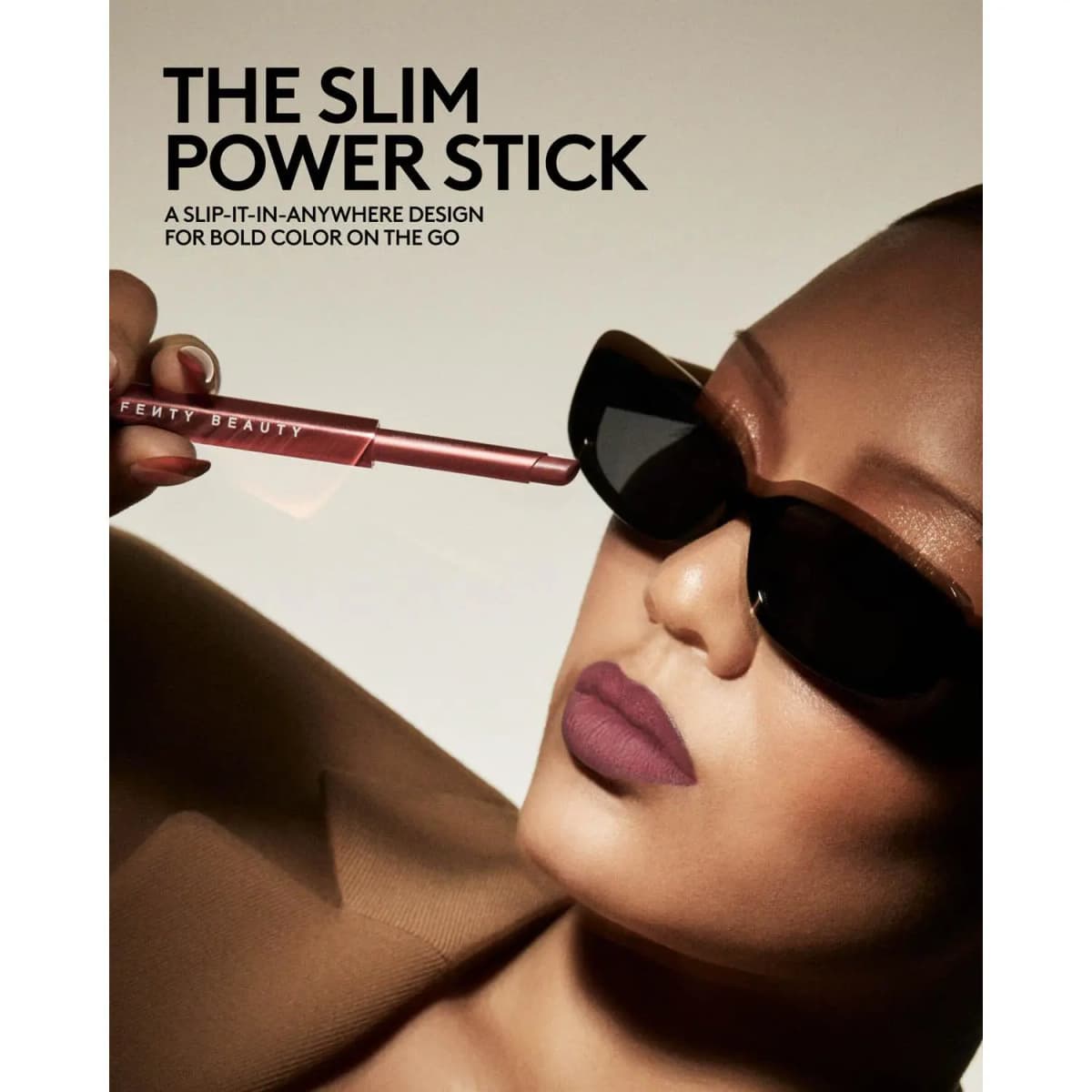 Model in black sunglasses holding a slim mauve stick to her face, wearing a mauve matte lip, titled The Slim Power Stick