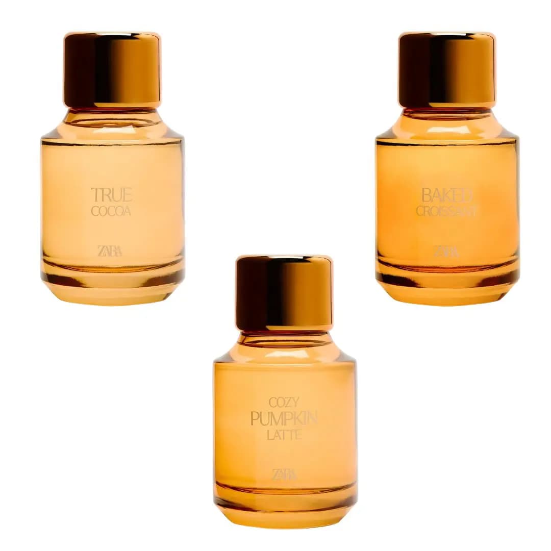 Zara True Cocoa, Baked Croissant and Cozy Pumpkin Latte Eau de Parfum bottles in amber glass with gold caps on white