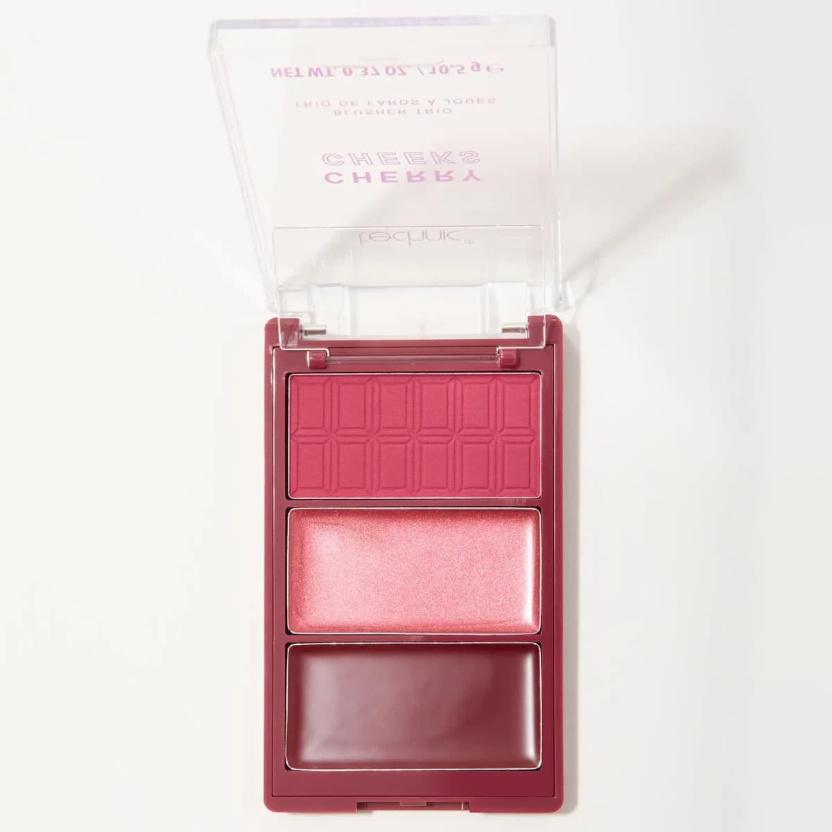 Cherry Cheeks blusher trio open with a chocolate-embossed berry powder, shimmery pink and deep plum cream
