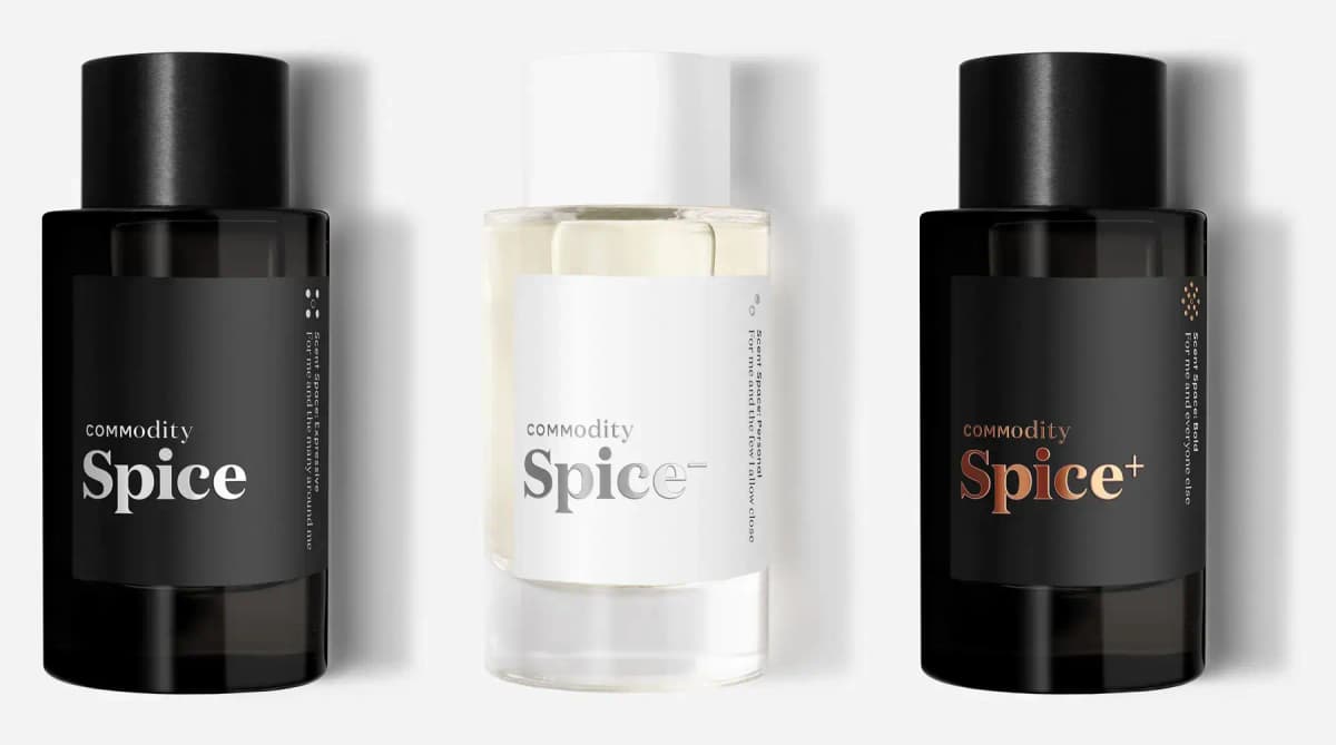 Three Commodity bottles side by side on white: black Spice, clear Spice- with white cap, and black Spice+