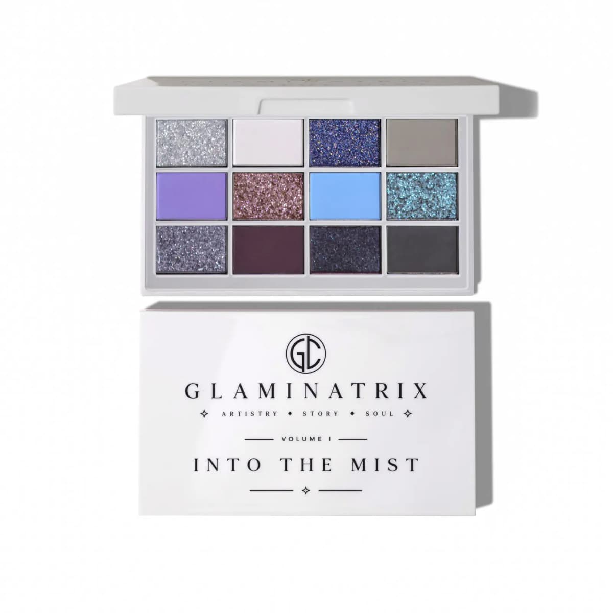 Open white 12-pan eyeshadow compact above its Glaminatrix Into the Mist Volume I box on a white background.