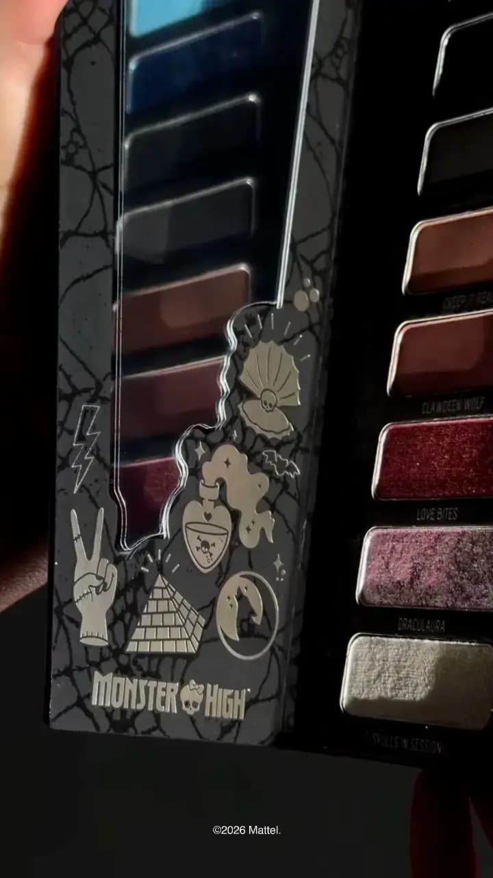 Open palette lid with silver foil icons beside shimmery berry, mauve pink and white shades labelled Love Bites and Draculaura