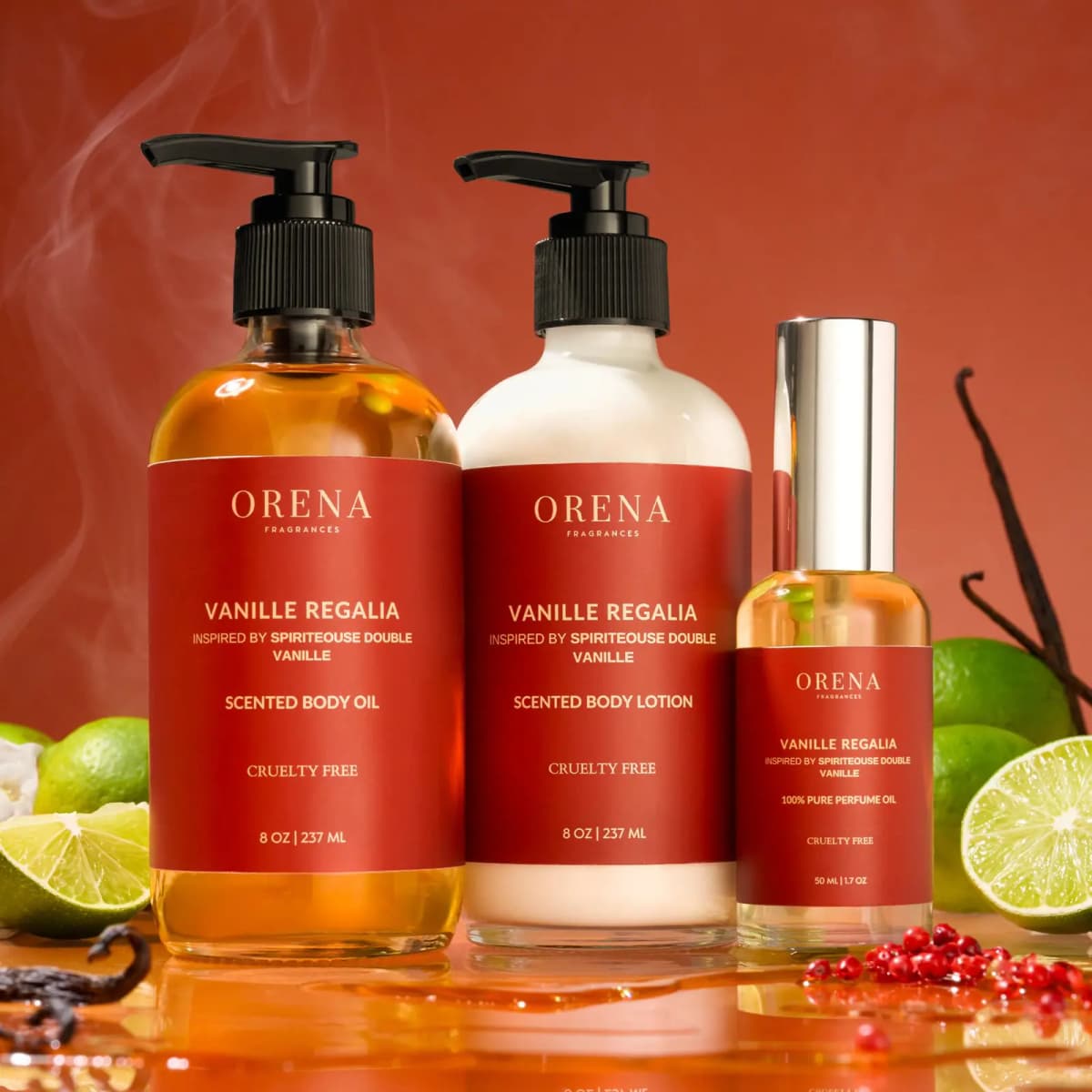 Vanille Regalia trio with red labels among limes, vanilla pods, pink peppercorns and wisps of smoke on a rust background