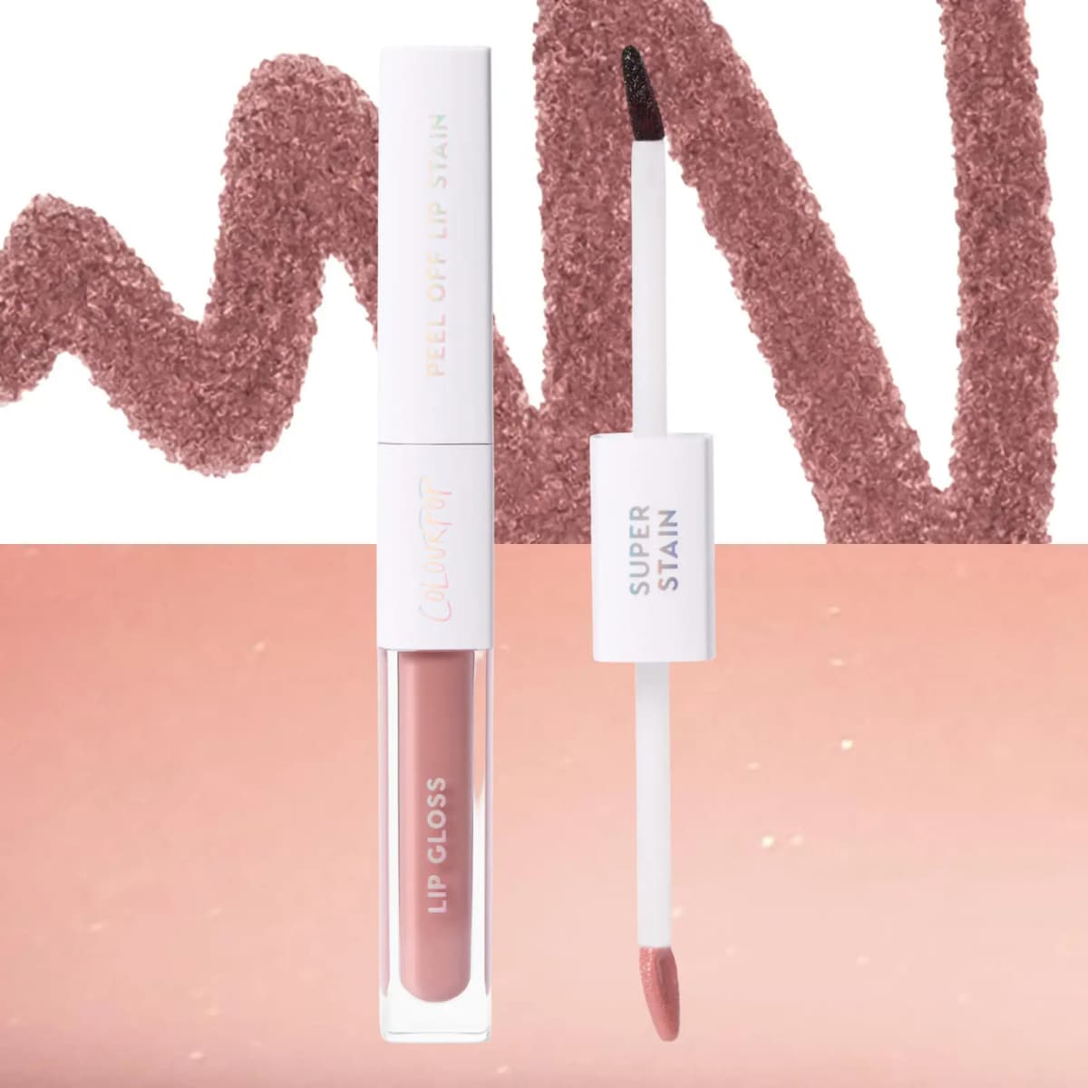 Duo uncapped with dark stain wand beside a creamy nude gloss, over a mauve stain scribble and peach gloss swatch