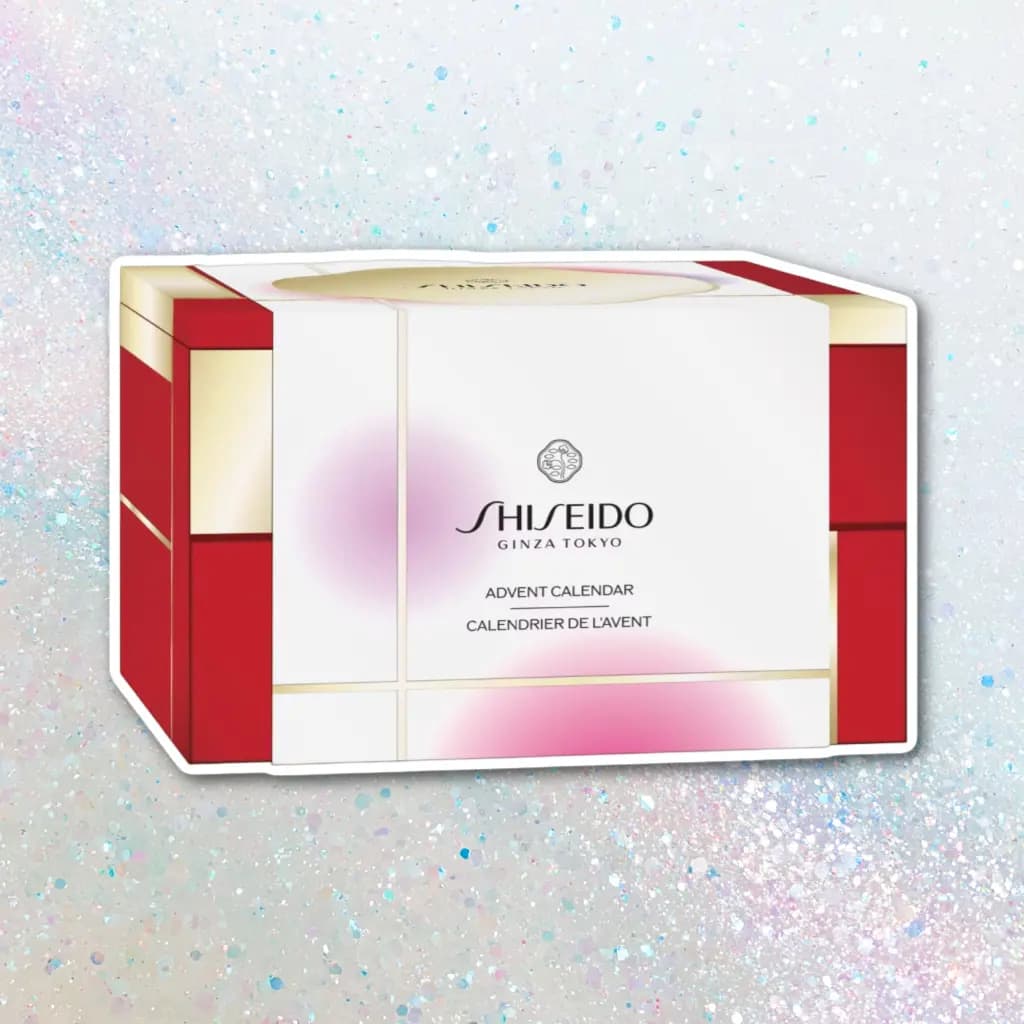 Closed white, red and gold Shiseido Ginza Tokyo Advent Calendar box on a sparkling iridescent background