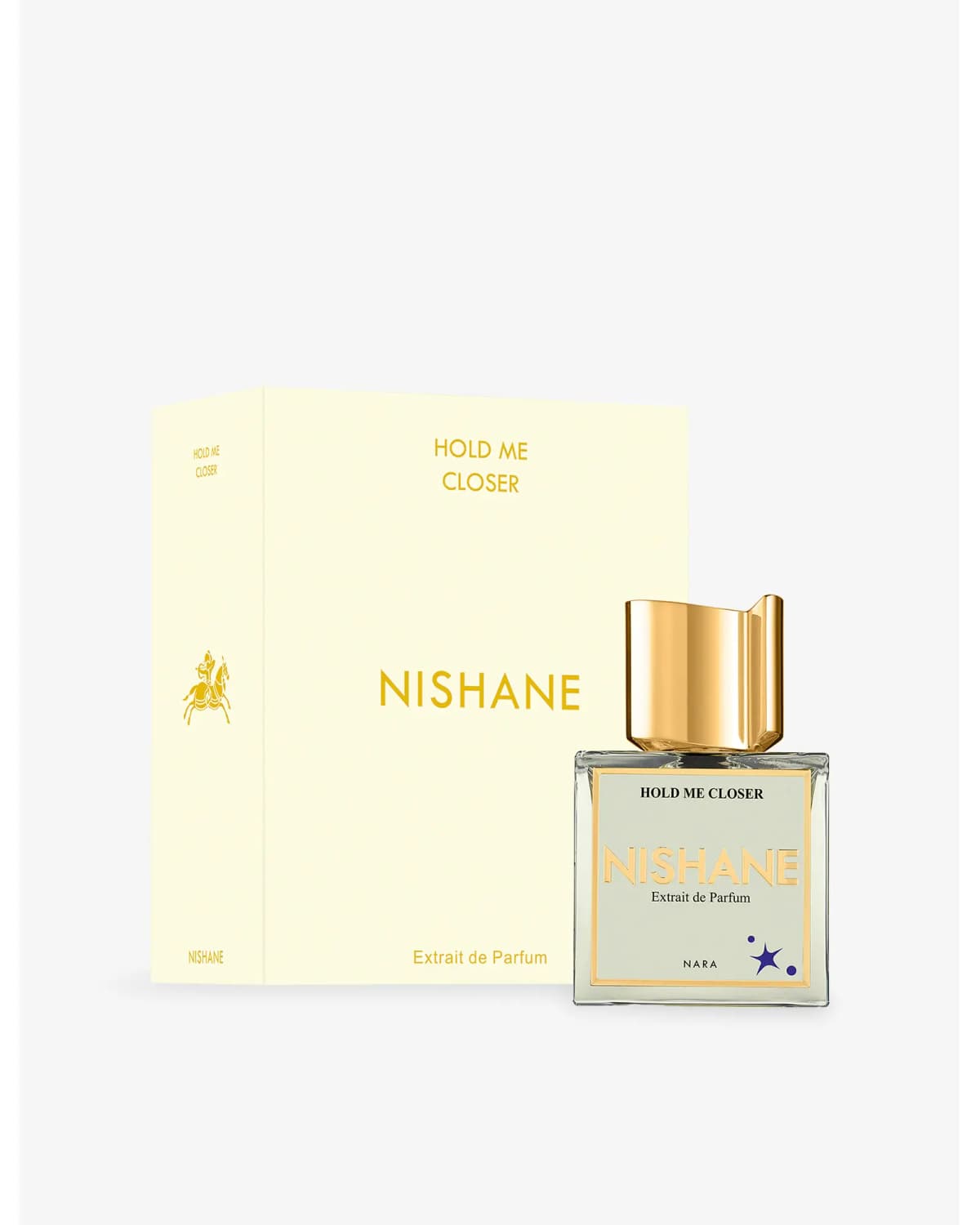 Pale yellow box with gold Nishane lettering and horse-rider emblem beside the square bottle with gold cap