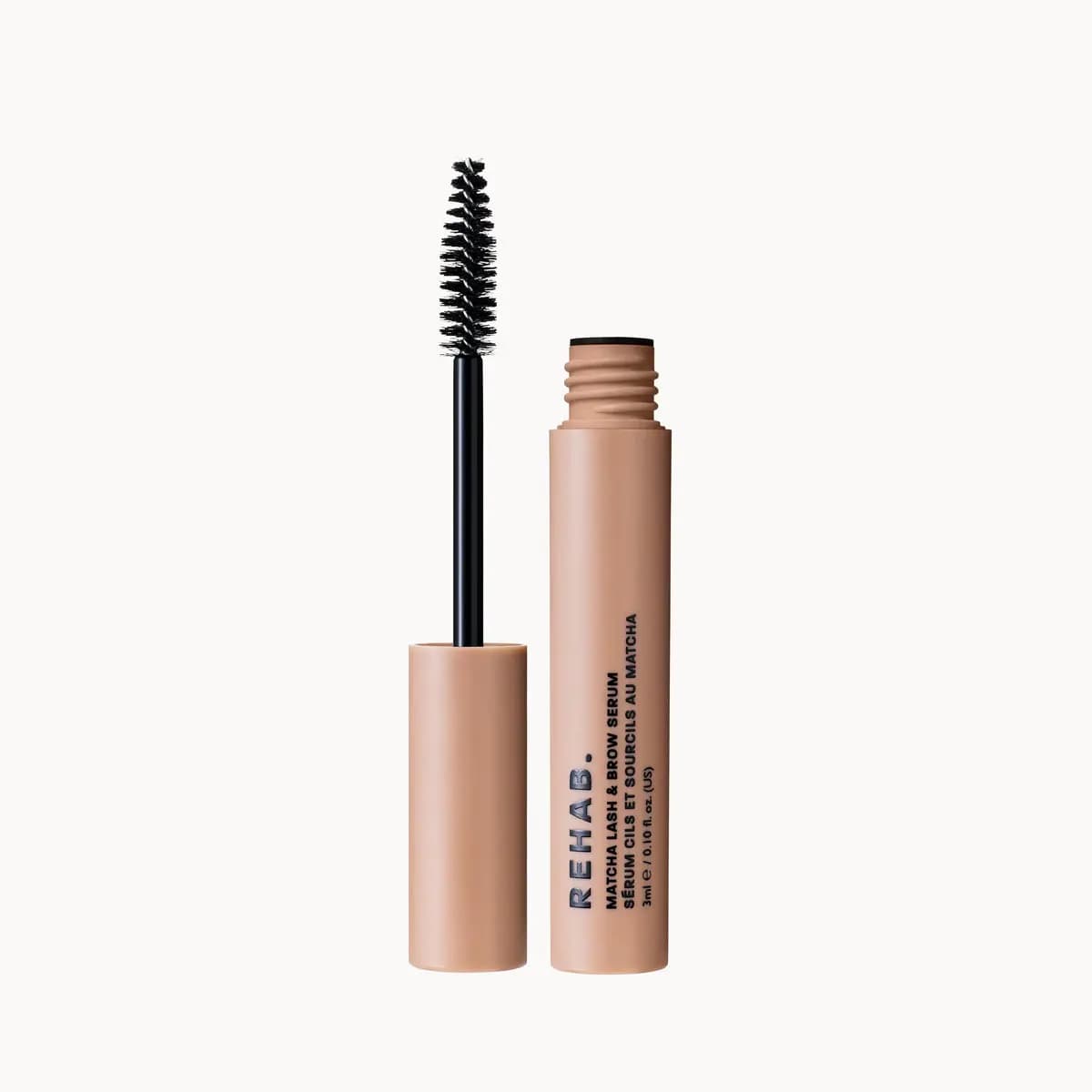 Matcha Lash & Brow Serum tube open with its black spoolie wand standing on the nude cap