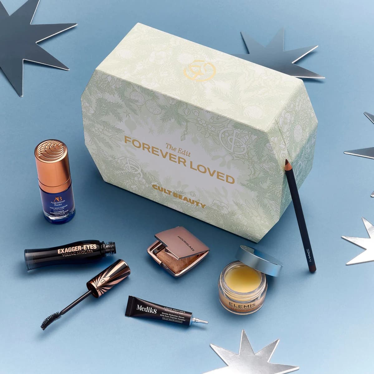 Sage Forever Loved box on blue with Augustinus Bader cream, Exagger-Eyes mascara, Hourglass compact and MAC pencil
