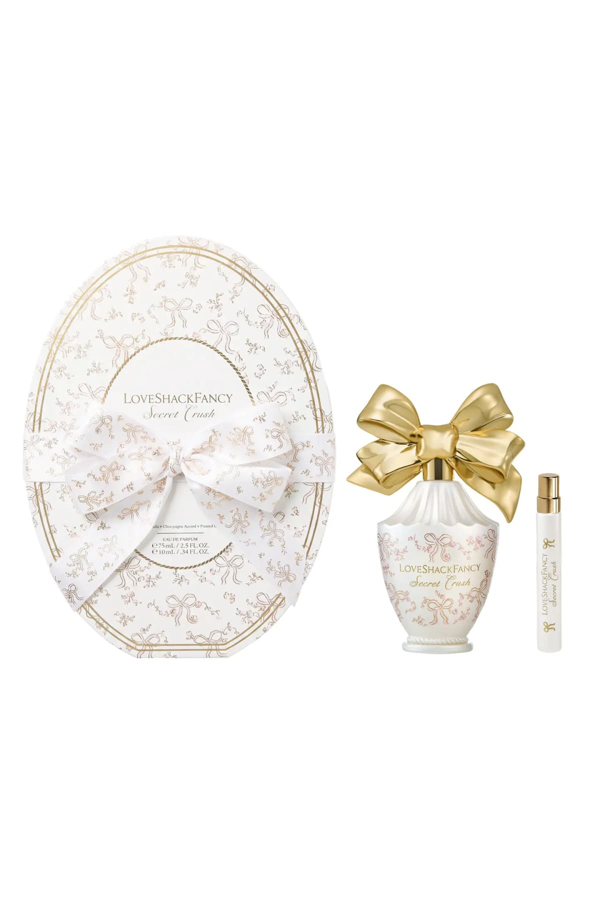 Secret Crush Vanity Set: oval ribboned box, 75mL pearly bottle with golden bow top and 10mL travel spray on white