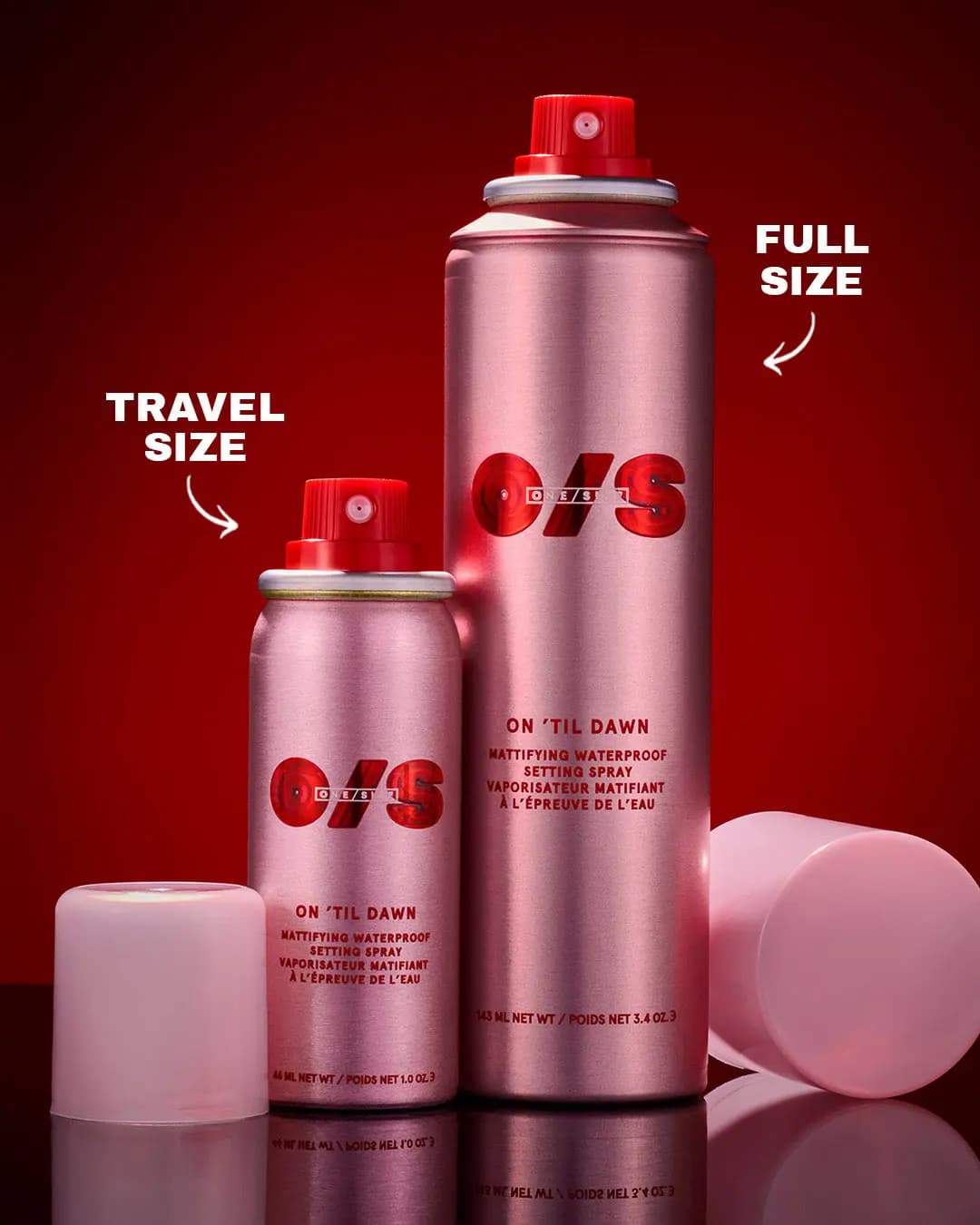 Pink travel-size and full-size On 'Til Dawn setting spray cans with red caps, labeled, on a deep red backdrop