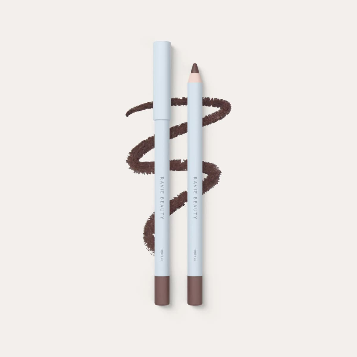 Ravie Beauty lip liner in Truffle, capped and sharpened pencils over a cool brown scribble swatch.