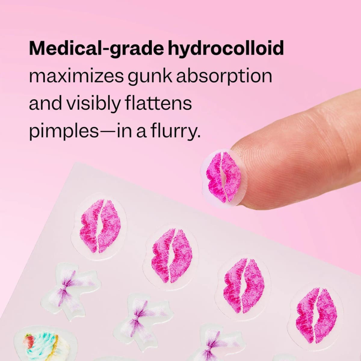 Fingertip lifts a pink lips-print hydrocolloid patch from a sheet of lips and bow shapes on pink background