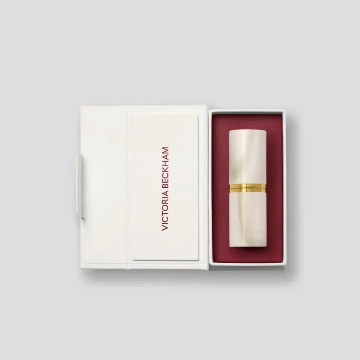 Marbled lipstick in an open white Victoria Beckham box lined with burgundy