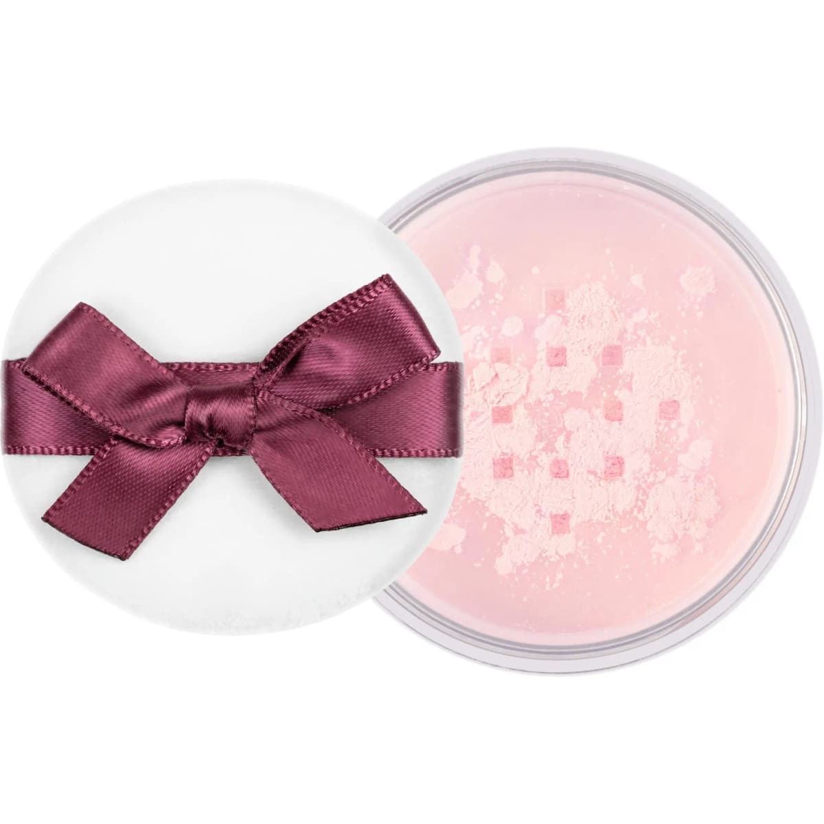 Top view of white bow-tied powder puff beside an open jar of pale pink loose powder