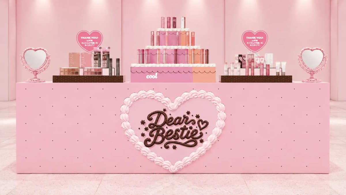 Dear Bestie pop-up counter with tiered tint cake display labelled cool, palettes, heart mirrors and Thank You heart signs