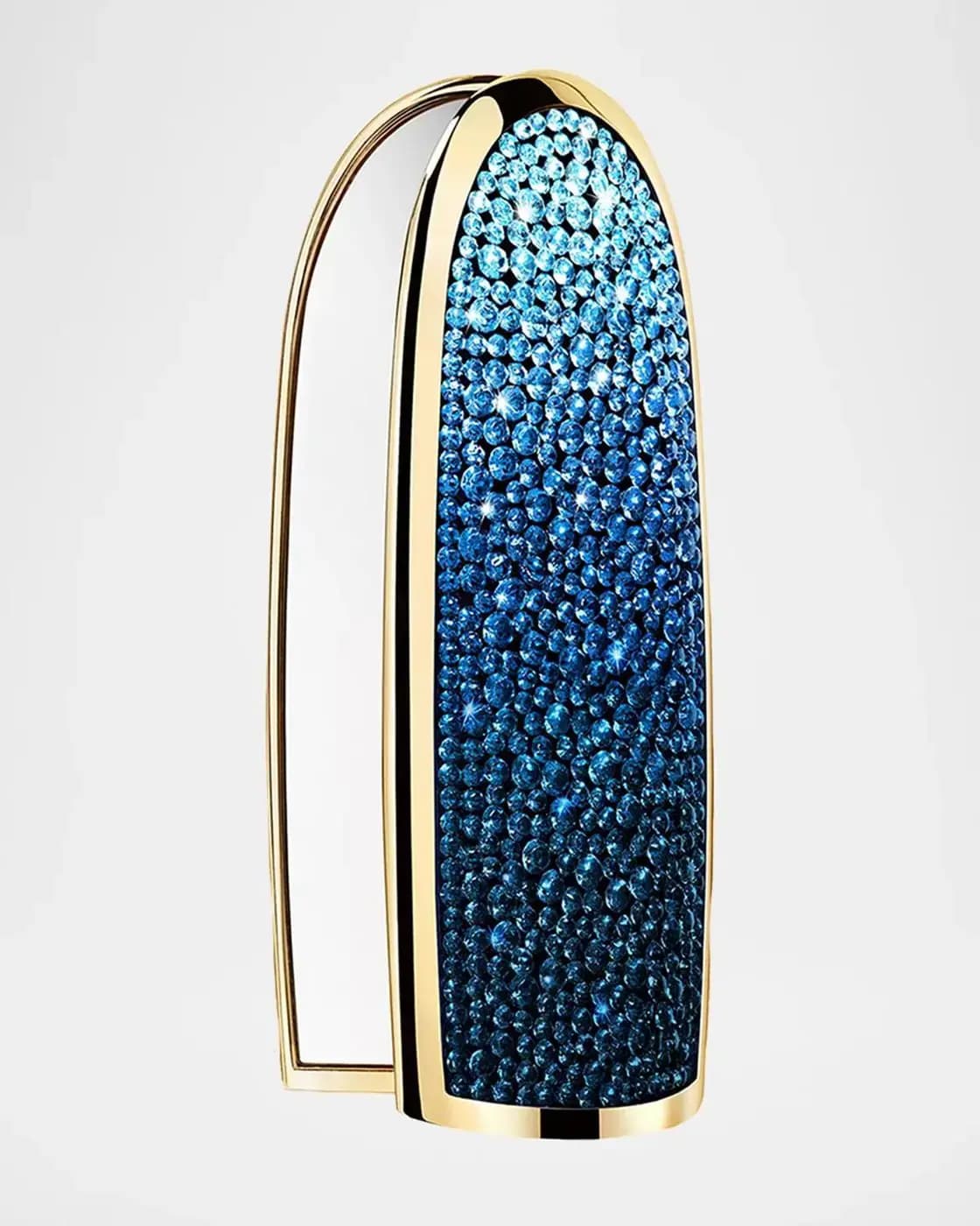 Gold-framed lipstick case covered in sparkling crystals fading from light aqua at the top to deep blue at the bottom.