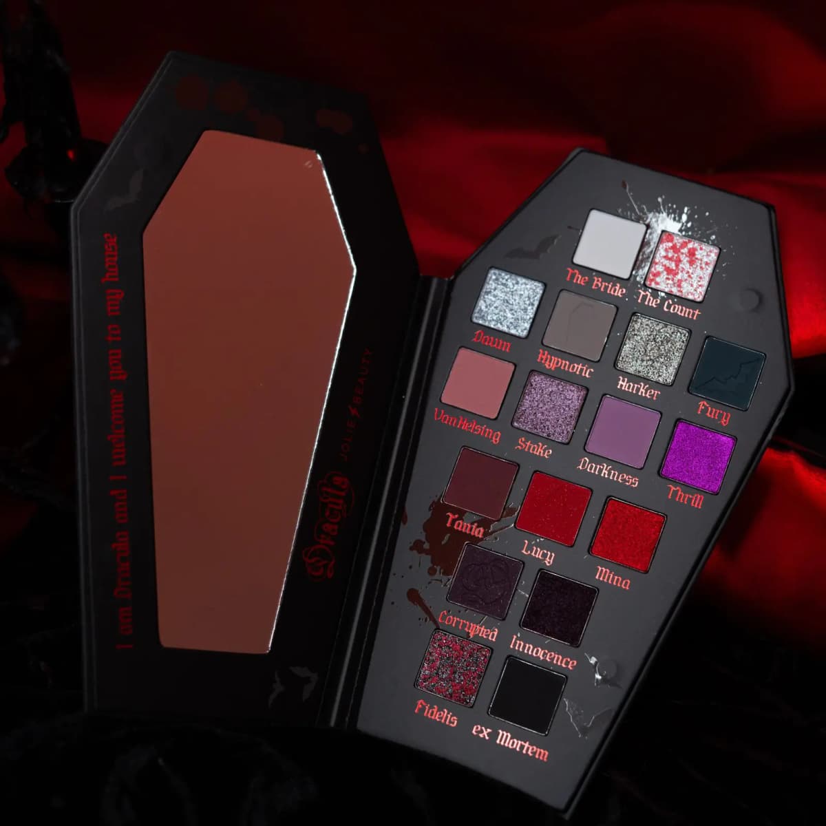 Open coffin palette with mirror and red 'I am Dracula and I welcome you to my house' text beside all 17 shades