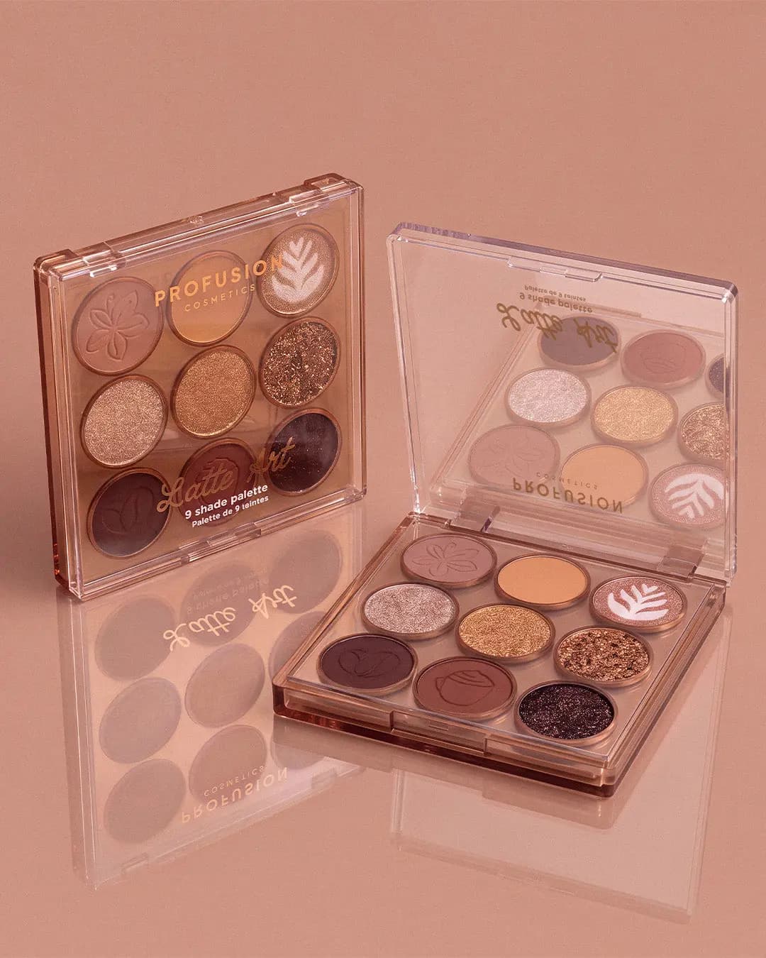 Two Latte Art palettes, one open, showing embossed flower and latte-art pans on a reflective blush-pink surface.